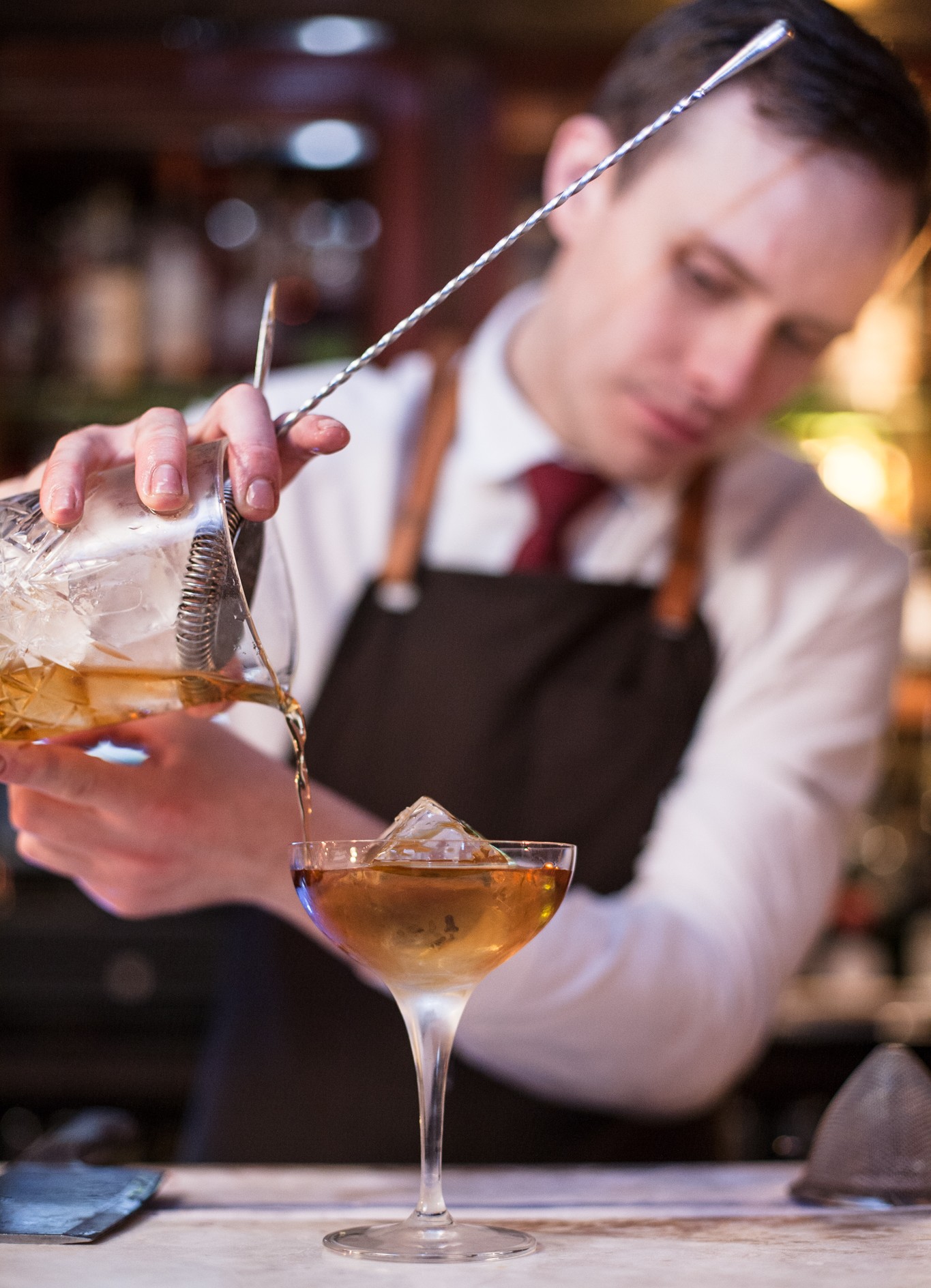 A VCC bartender preparing a drink