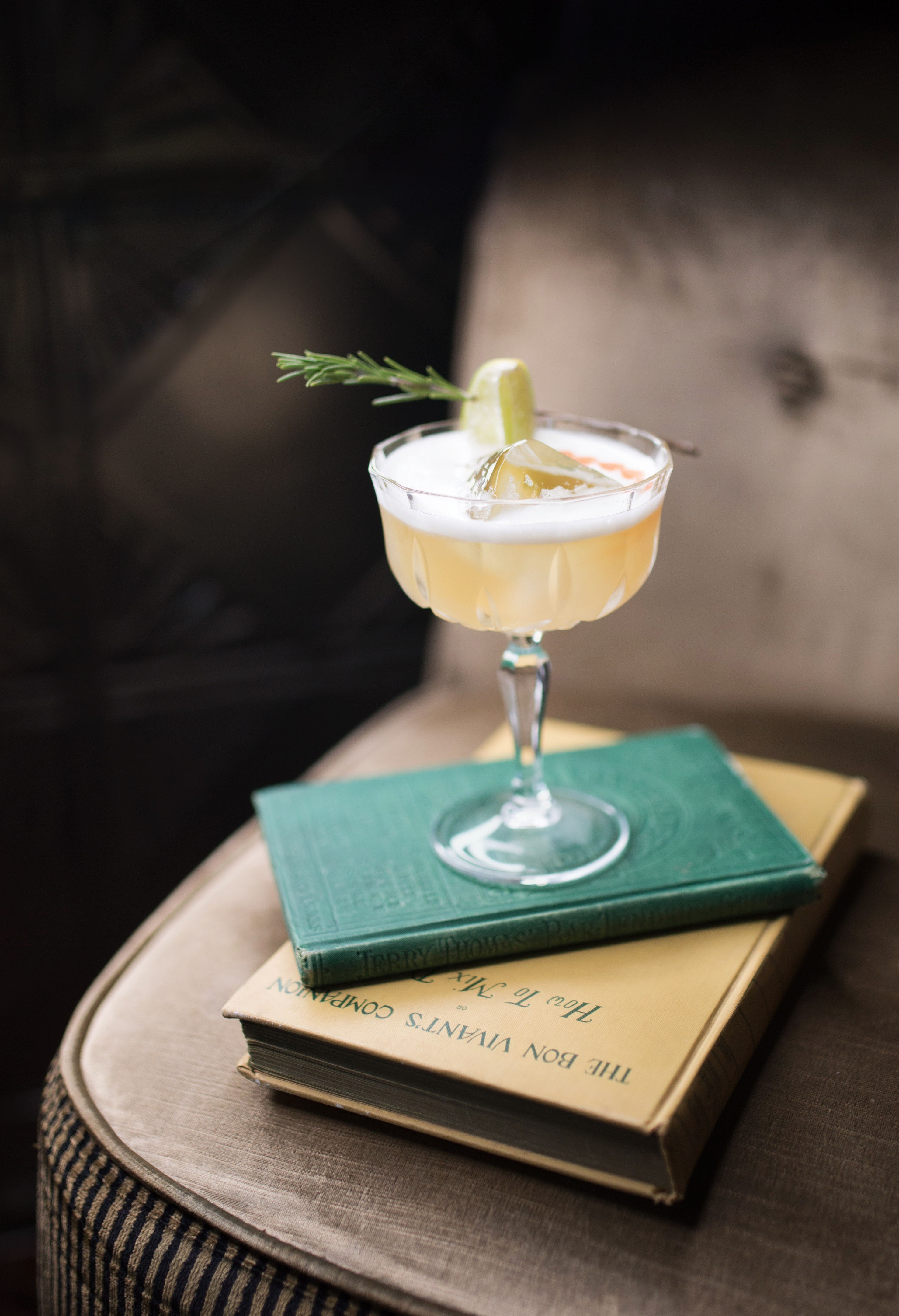 A cocktail presented on a vintage book