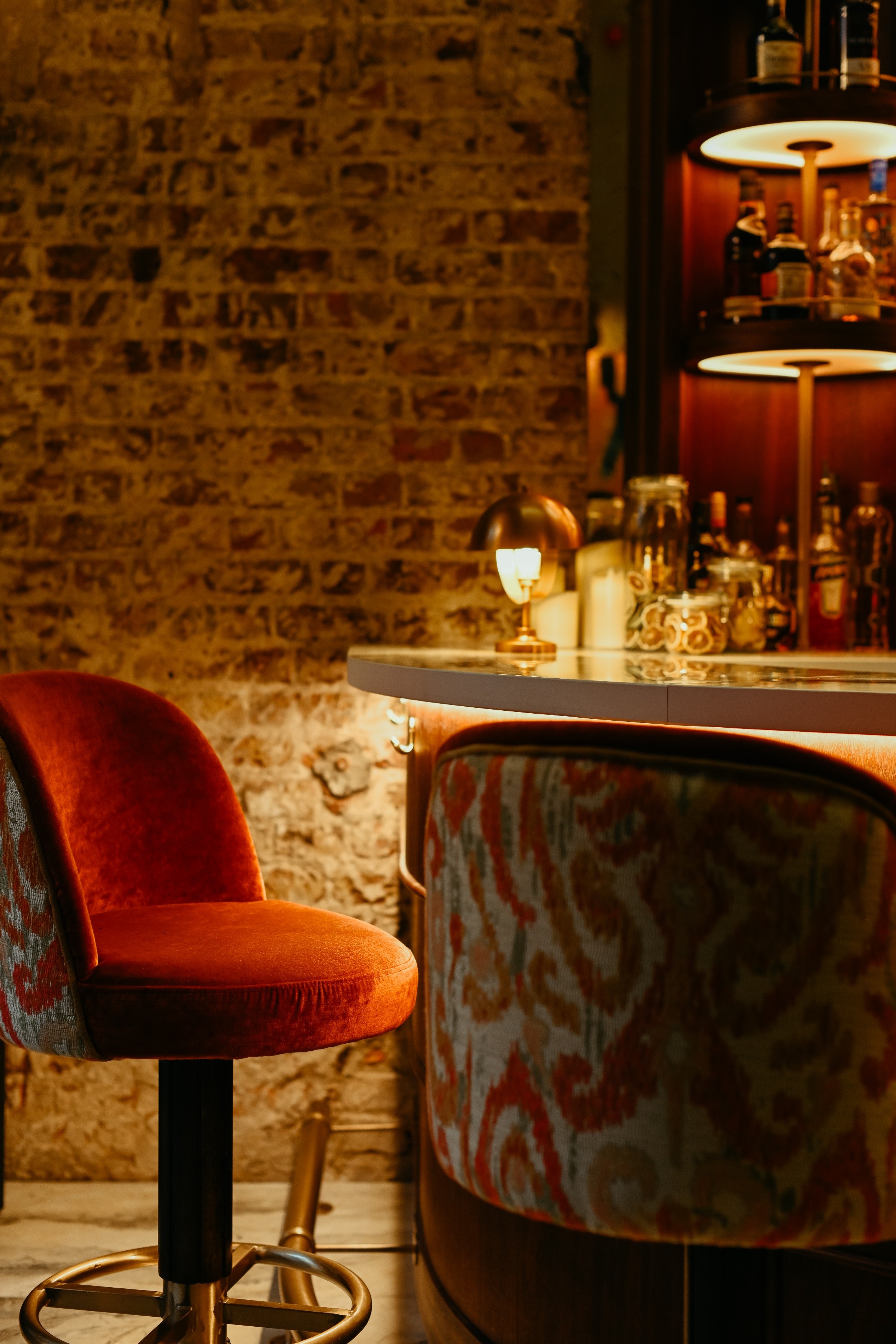 Curved bar with upholstered vintage bar stools