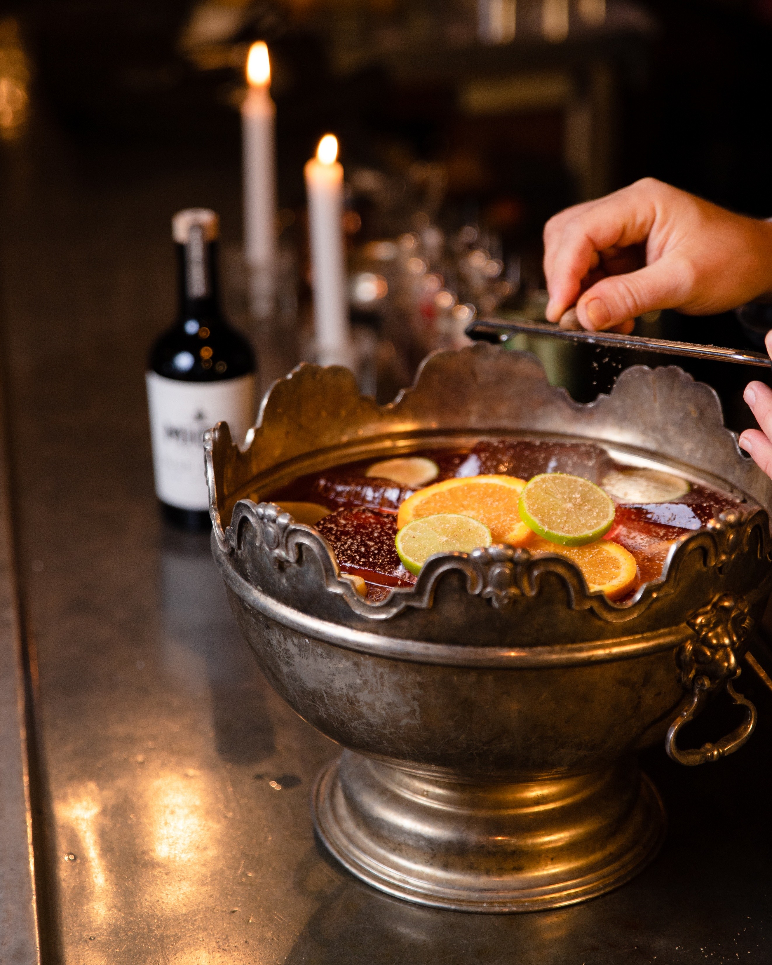 A generous bowl of punch with citrus garnishes